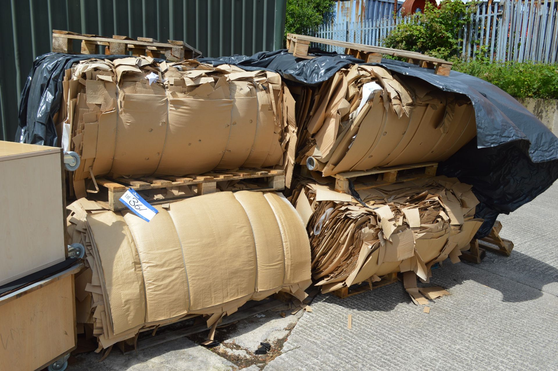 Baled Corrugated Cardboard, as set out in one area