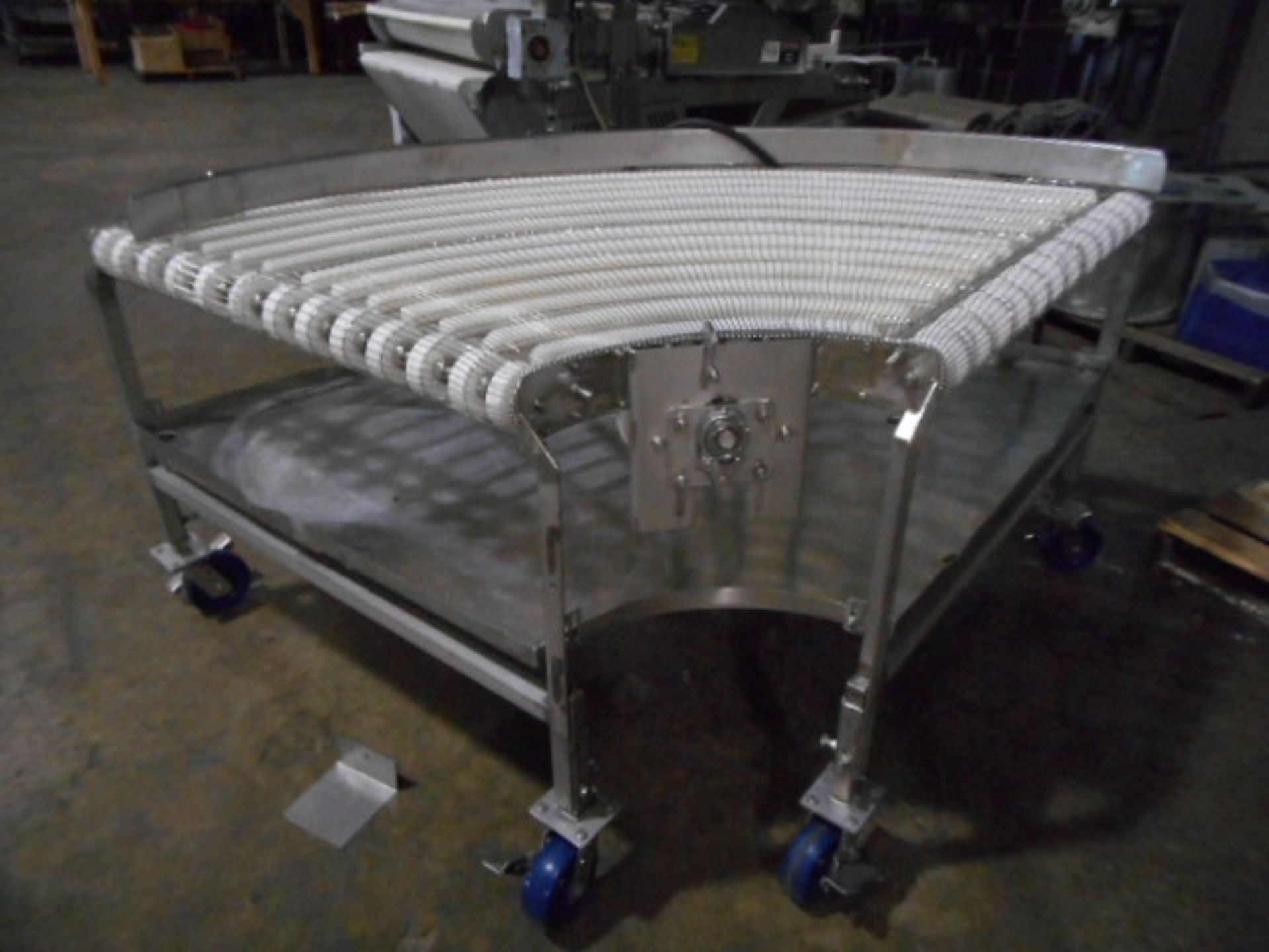 (Located in Cartersville, GA) 40” wide 90 degree conveyor Manufacturer unknown Like new condition