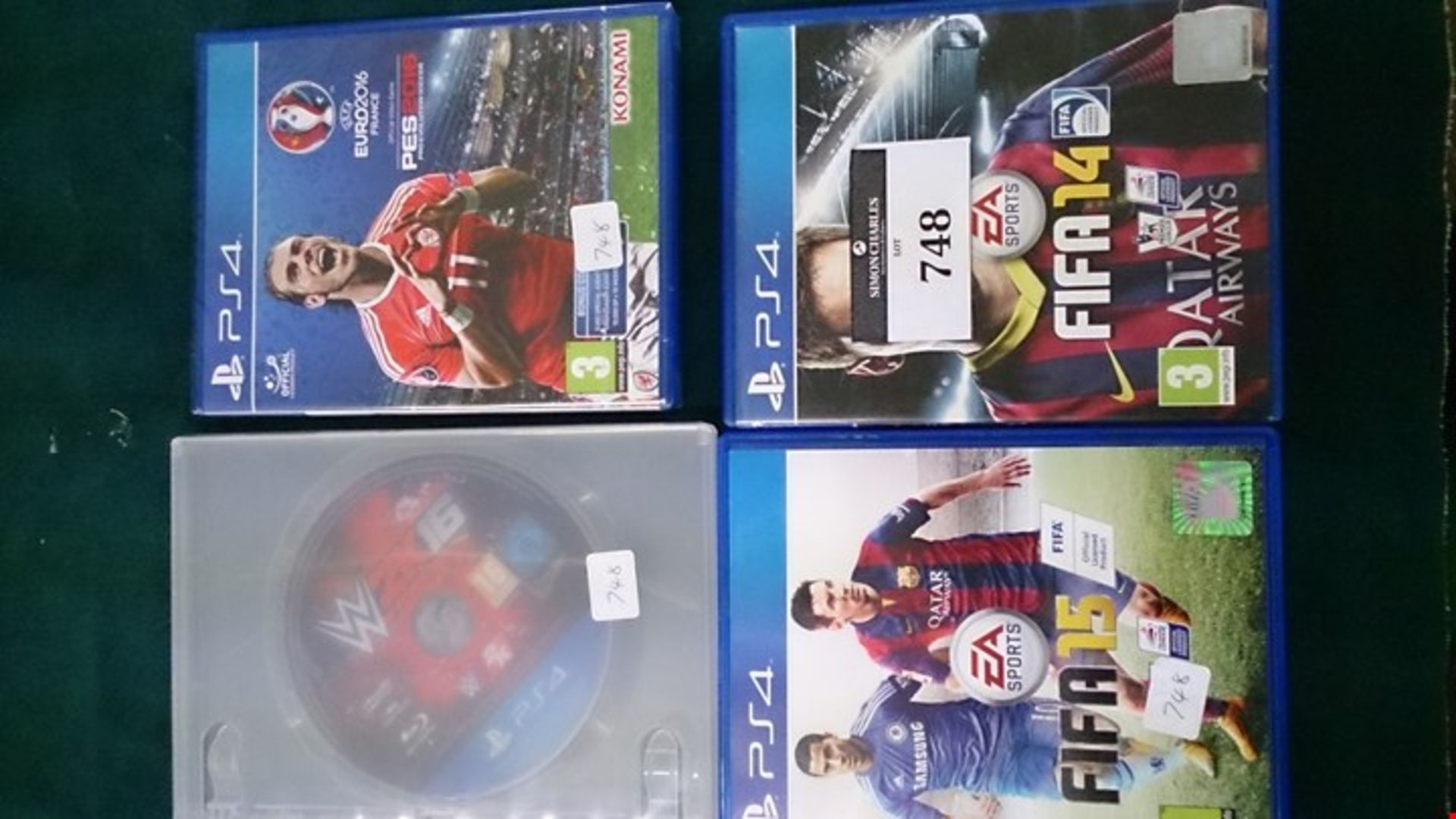 4 BOXED PS4 GAMES. PES 2016 ( SEALED), FIFA 14, FIFA 15 AND W2K16