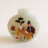 An Embellished White Jade Snuff Bottle