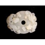 A White Jade Pendant Carving of a Dragon 18/19th Century