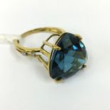 9CT GOLD & BLUE TOPAZ RING SET WITH 4 DIAMONDS TO THE SHOULDER - SIZE M/N