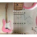 PINK STRAT STYLE ELECTRIC GUITAR SIGNED ON SCRATCHPLATE BY AMY WINEHOUSE