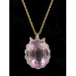 STUNNING 198 CARAT KUNZITE MOUNTED ON 18CT GOLD & DIAMOND CLUSTER PENDANT HELD BY A 9CT GOLD CHAIN