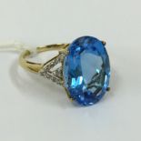 9CTGOLD & OVAL CUT BLUE TOPAZ RING WITH DIAMONDS TO THE SHOULDER - SIZE M/N