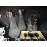 Two crystal claret jugs, cruet set and flatware