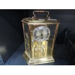 A modern brass anniversary clock