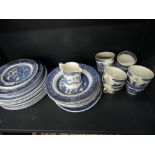 A selection of blue and white willow pattern tea/dinner ware