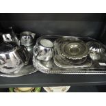 A tray of stainless steel and plated ware