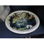 A Moorcroft plate of late 20th century bull rush pattern, on cream ground painted mark WM 95