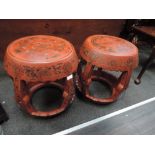 A pair of early 20th century Chinese Cinnabar lacquer stools of drum shape having foliate