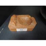 An oak ashtray by Robert 'Mouseman' Thompson with signature mouse carving