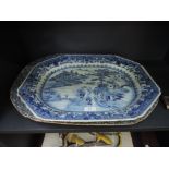 An early 19th century Chinese blue and white platter having typical decoration and a 19th century