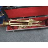 An early 20th Century brass slide trumpet, Inscribed Excelsior Sonourus, Class A, Hawkes and Son,