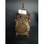 A late 20th century brass reproduction lantern clock by Smiths