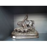 A Spelter bronzed figure, modelled as huntsman and dogs, signed P J Mene, 1889