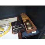 A vintage Gillette razor in case and a set of brass apothecary weights in box