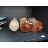 Three stoneware hot water bottles