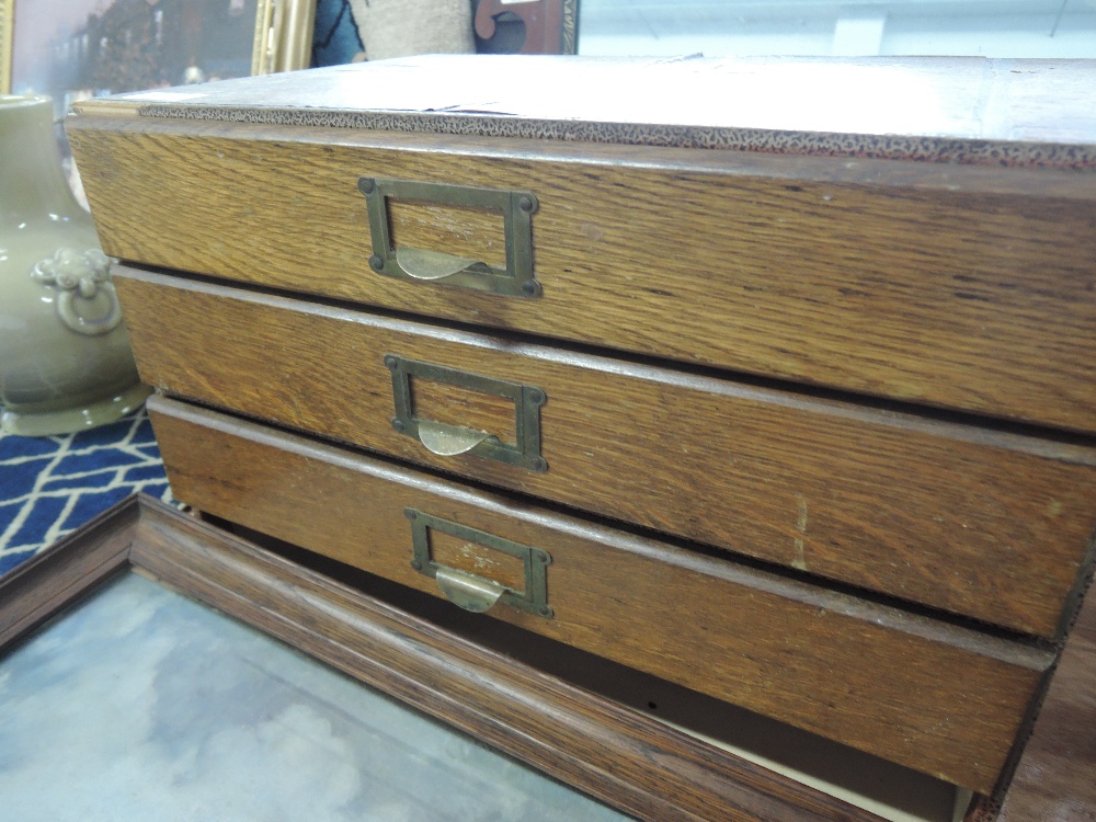 A mid 20th century oak set of milliners drawers