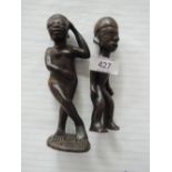 A treen figure of an African woman and a similar figure