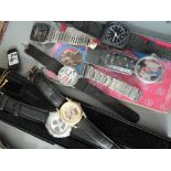 A selection of fashion watches and a watch strap