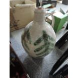 An art pottery flagon having leaf decoration by John Solly, Maidstone