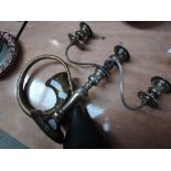 A vintage brass car horn and plated candelabra