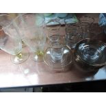 A selection of glasses including gilt glasses with saucers