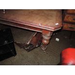 A Victorian mahogany extending dining table