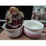 A vintage doll and two chamber pots