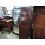 An Edwardian mahogany triple wardrobe