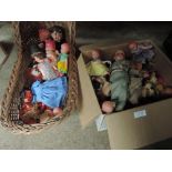 A box of dolls and a dolls crib including dolls