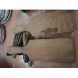 A pair of vintage butter pats and vintage clothes pegs