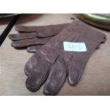 A pair of childs leather gloves