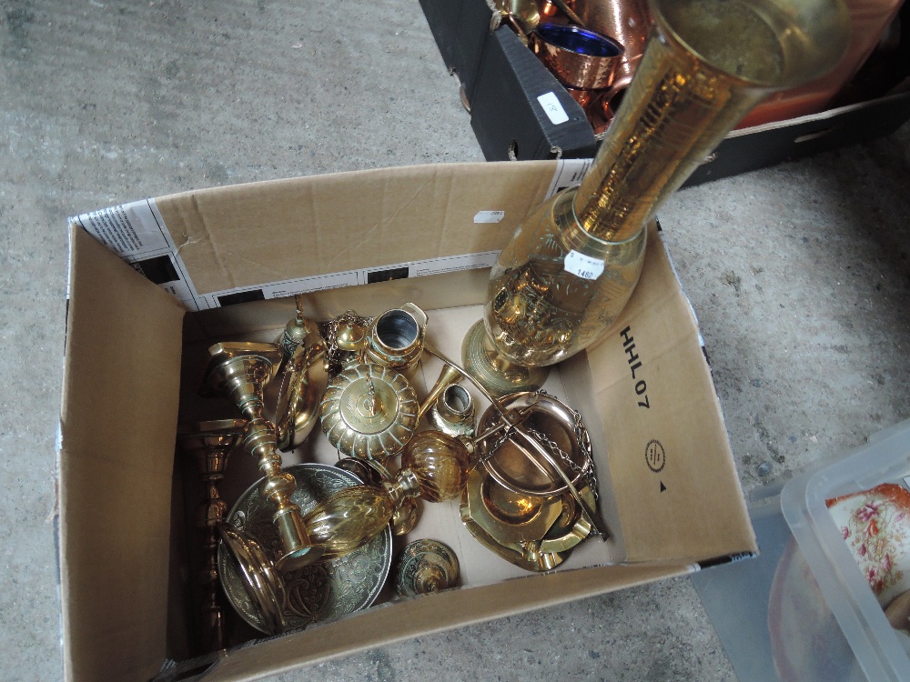 A box of brass ware including ornate scales and vase