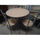 A modern bistro style table and chairs