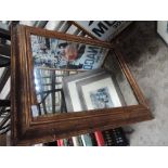 A gilt framed mirror