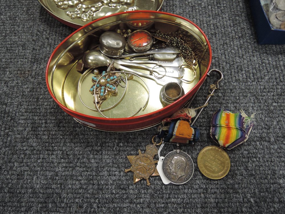 A box containing three World War I medals to Lieut T Lovett/Capt Lovett RAMC, plus other items