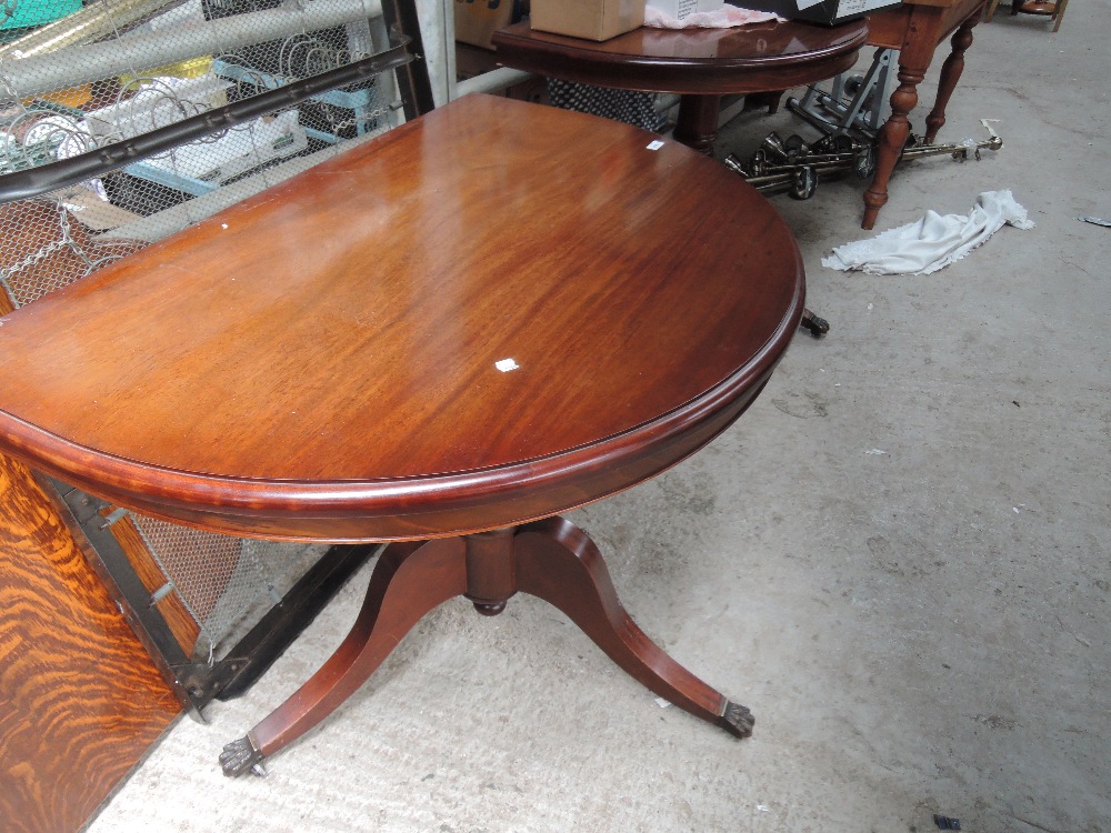 A reproduction Regency dining table