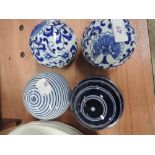 A set of 4 reproduction blue and white carpet bowls