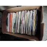 A box of 7' vinyl records