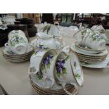 A part tea service stamped Victoria Australia with gilted pansy design