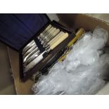 A box of various flatware including viners