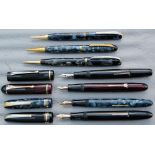 Four Burnham Fountain pens and three pencils