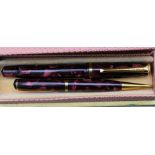 A Burnham Fountain pen and pencil set - red marble