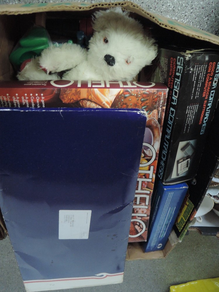 A box of mixed toys and games inc Merrythough style teddy bear, computer chess, Othelo etc