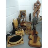 A selection of treen including art deco style candlesticks, ethnic carvings etc