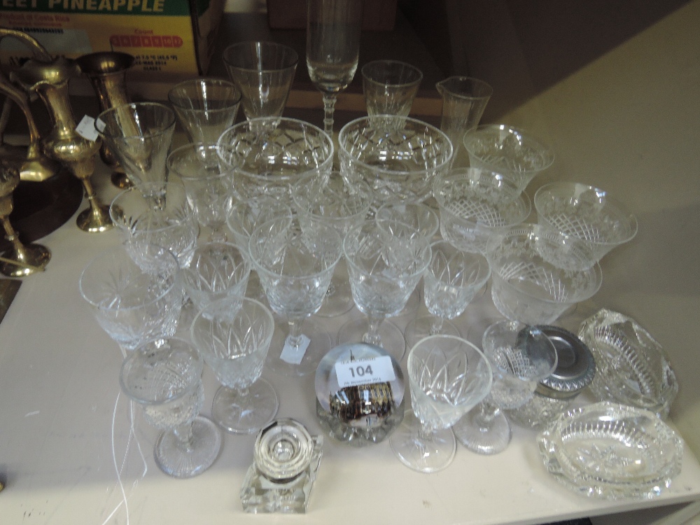 A selection of cut glass dinking glasses, desert bowls, a metal topped dressing table pot, a metal