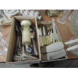 A box of flatware and a studio pottery vase