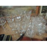 A selections of etched wine glasses and flutes etc